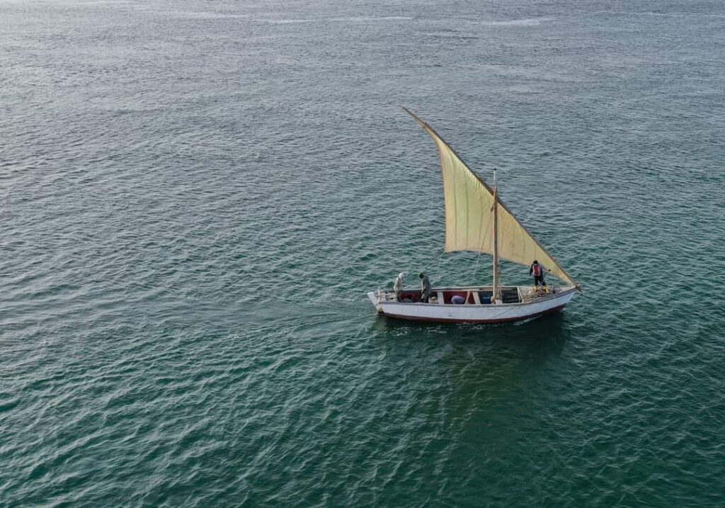An artisan fishing boat sails in the Mauritanian Atlantic seawaters