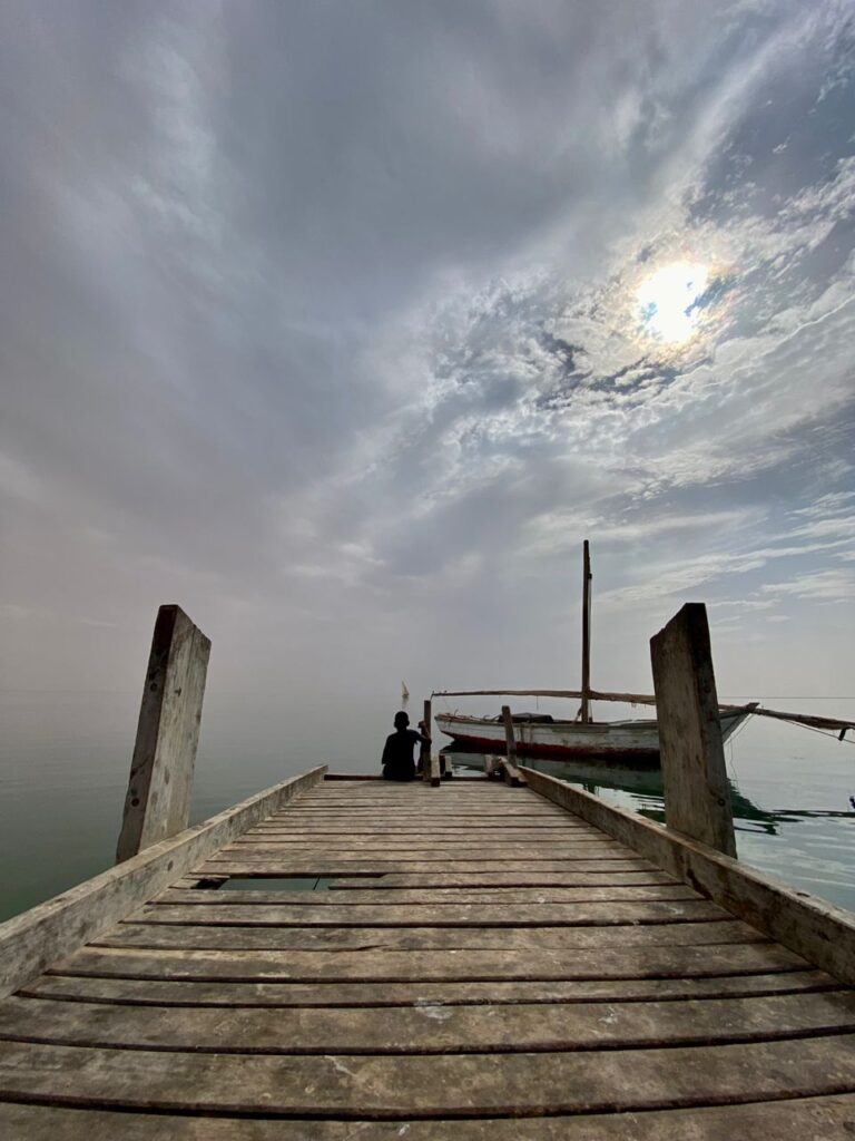 A vacant dock under sunny skies