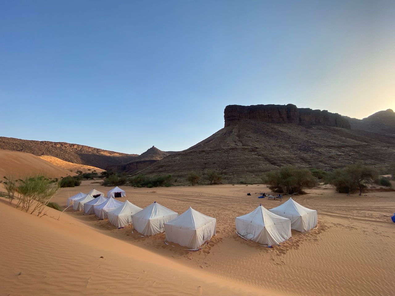A luxury campsite is seen at the base of the Big Dunes of Azoueiga