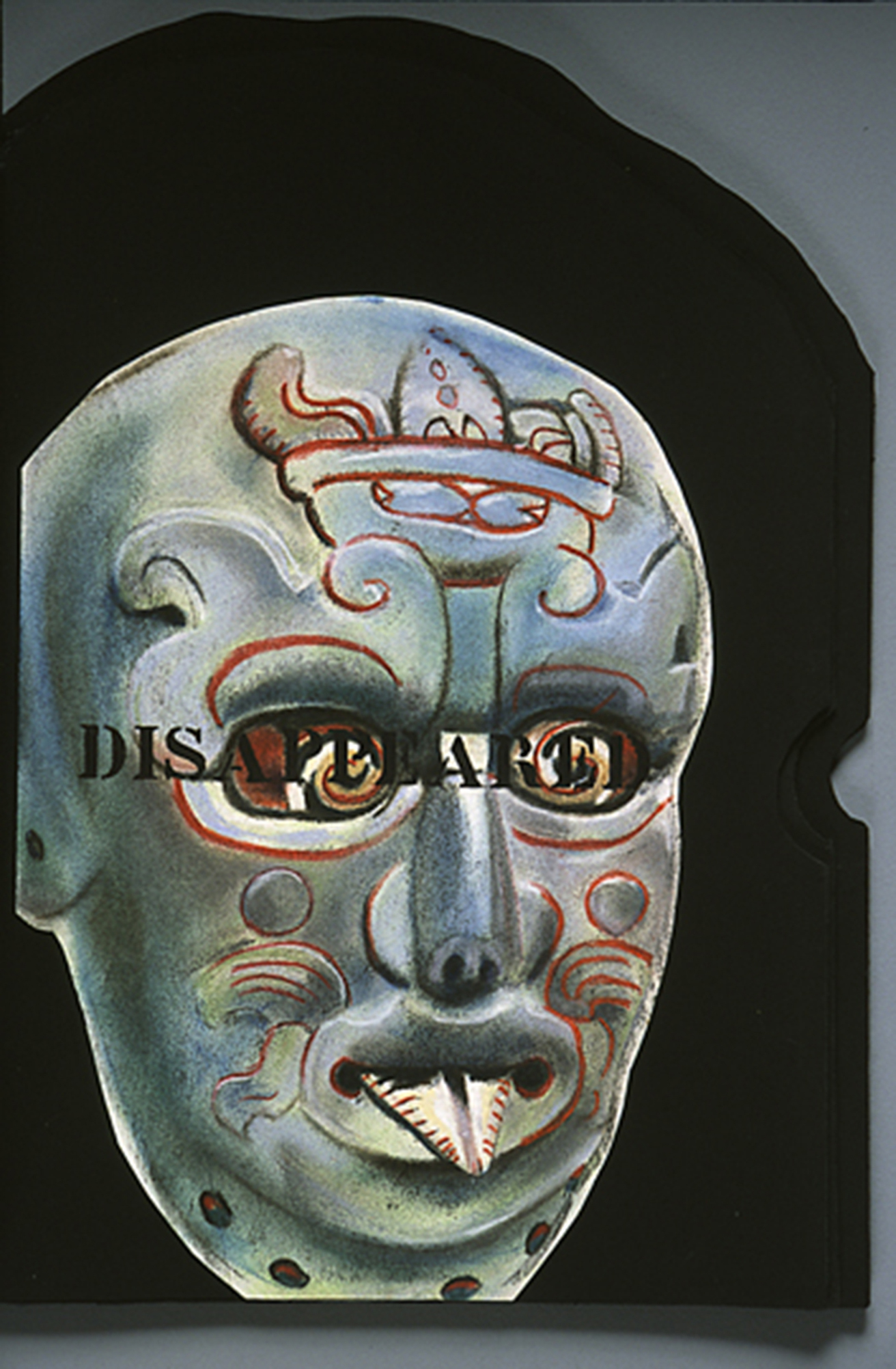 Inside page showing an ornate silver, cultural mask