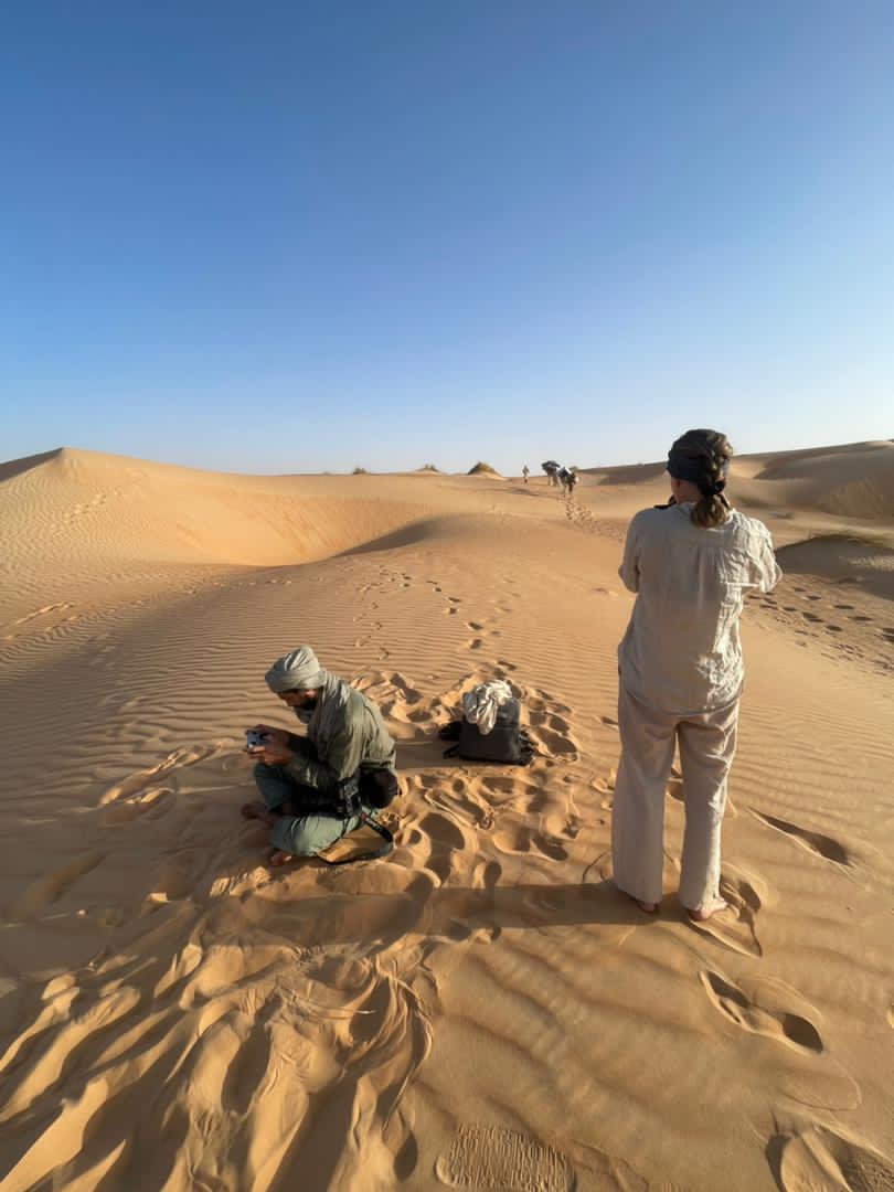 A trekker stays back behind the trekking line to capture a photo