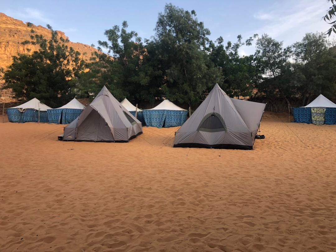 A large encampment site showing nomadic and modern tent styles