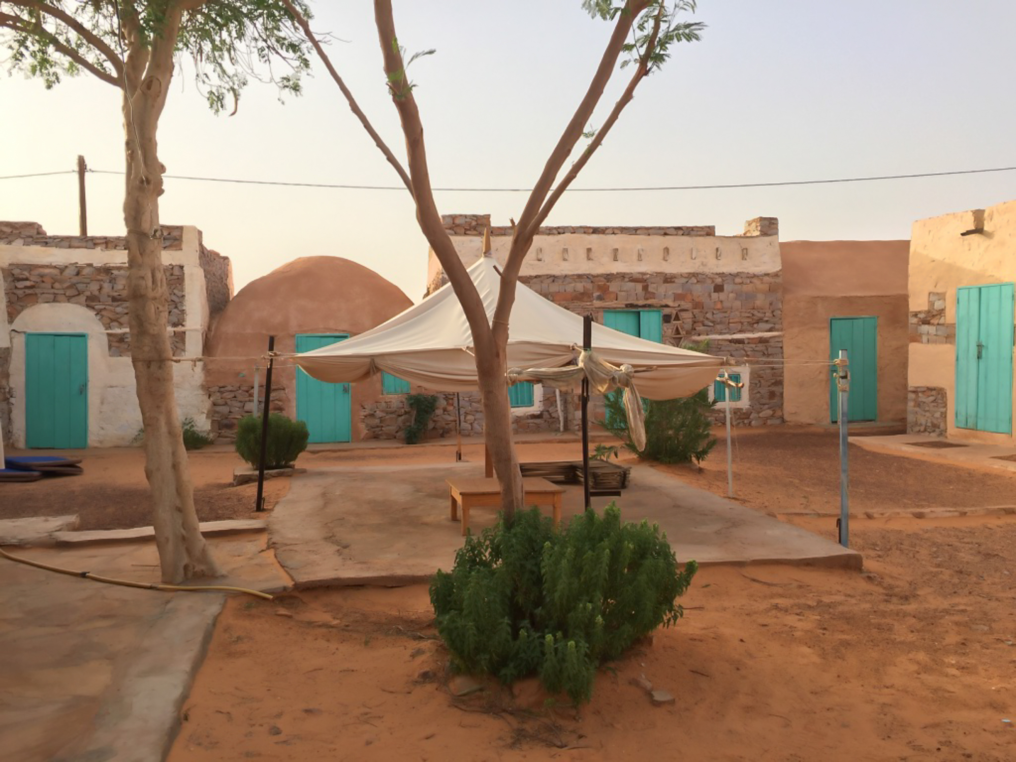 An open sqaure in Chinguetti showing colorful painted doors