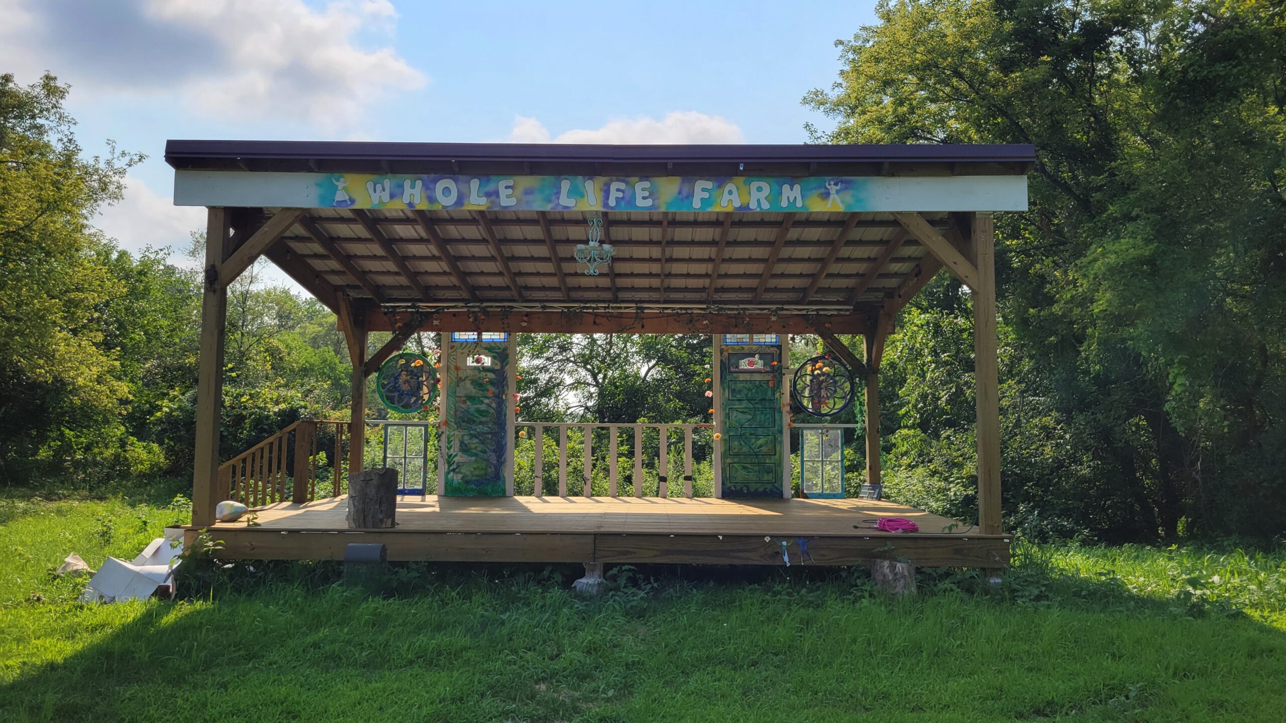 Whole Life Farm performance stage at dawn